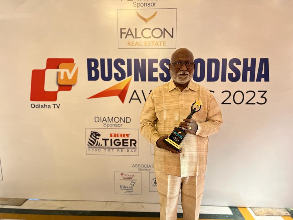 Kasturi Food Products team at award function — group photo with award certificate